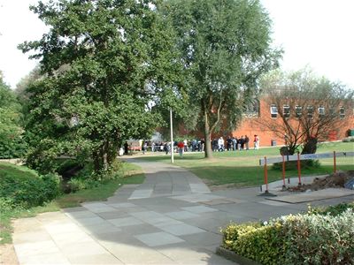 The sports hall with the queue for registration